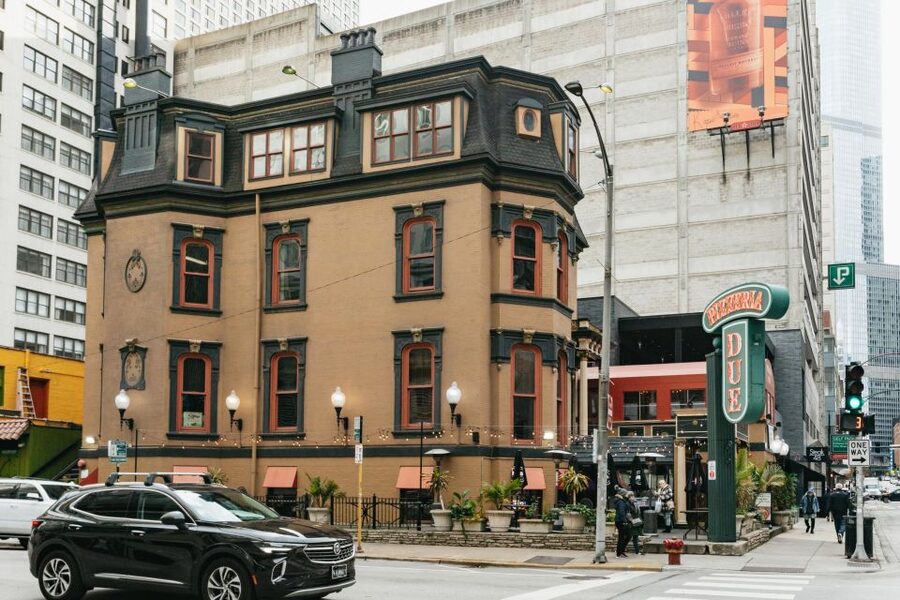 Chicago: Gangsters and Food Tasting Walking Tour - Brothel mansion, gangster-shooting cathedral, and other deadly landmarks