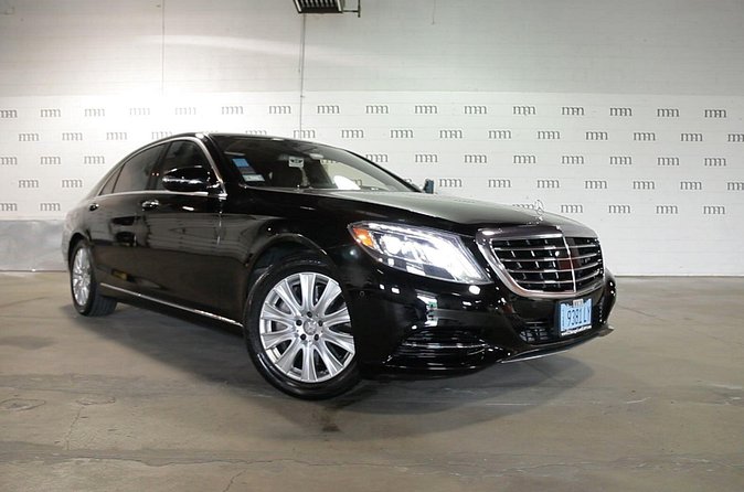 Private 4-Door Mercedes Limo Transfer from or to Chicagoland Airport and Suburbs - Meeting Your Driver at the Baggage Claim Area